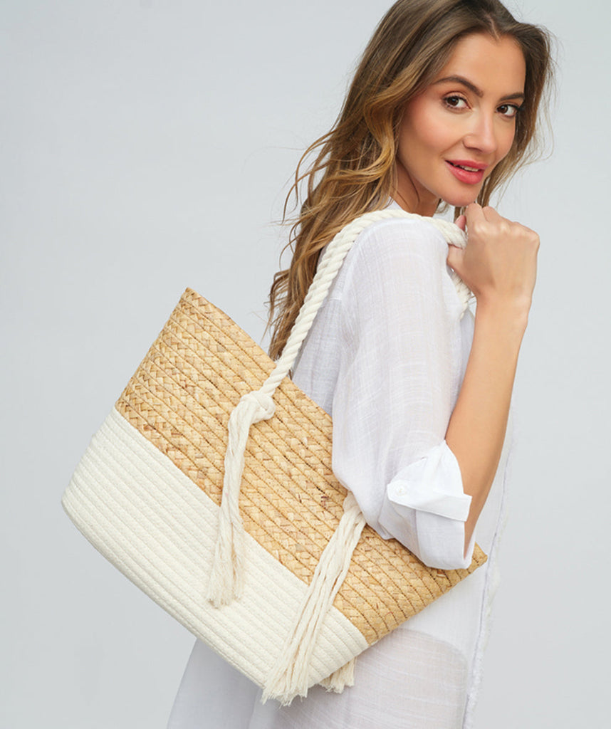 Model View: Natural/White Striped Straw Tote with Rope Handles and Zip Closure