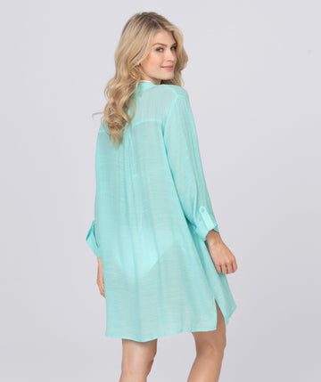 Back View: Aquamarine Fringed Beach Shirt with Button Closure and Rolled Cuff Sleeves